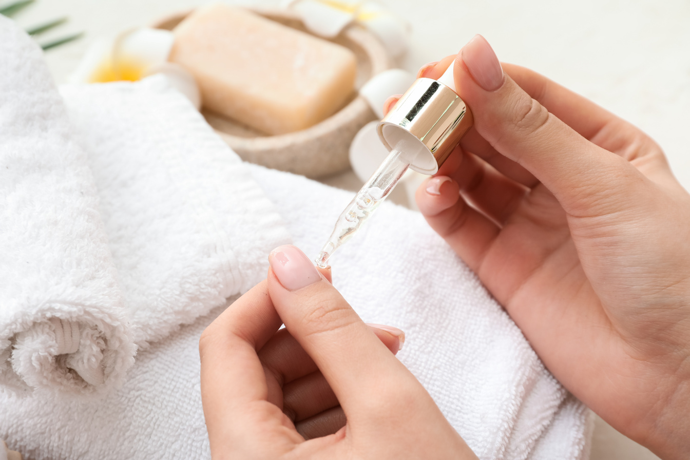 Female Hands with Cuticle Oil and Clean Towels, Closeup
